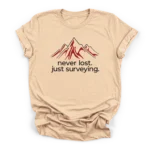 Stylized mountain range illustration with the text never lost just surveying centered underneath on a Premium T-Shirt.