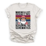 Retro vector illustration of Santa in a hard hat holding blueprints with text reviewing the schematics on a Premium T-Shirt.