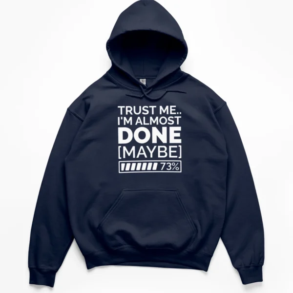 Typography reading TRUST ME I'M ALMOST DONE MAYBE with a 73 percent loading bar graphic on a Hoodie.
