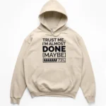 Typography reading TRUST ME I'M ALMOST DONE MAYBE with a 73 percent loading bar graphic on a Hoodie.