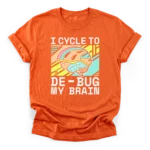 A stylized brain wearing a bicycle helmet over a geometric background with the text I cycle to de-bug my brain on a Classic T-Shirt.